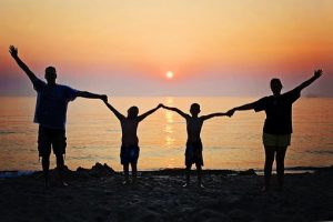 family in harmony and enjoying the sunset